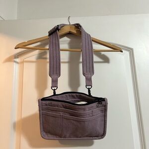 The Particulars convertible pack bag in light purple‎ with extra strap